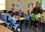 Mrs Ovia teaches the boys some Nigerian greetings and introduces them to some of the music as well.